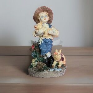 MVP DESIGNS COMMERCE POLY CHILD - RESIN FIGURINE BOY WITH PIGS